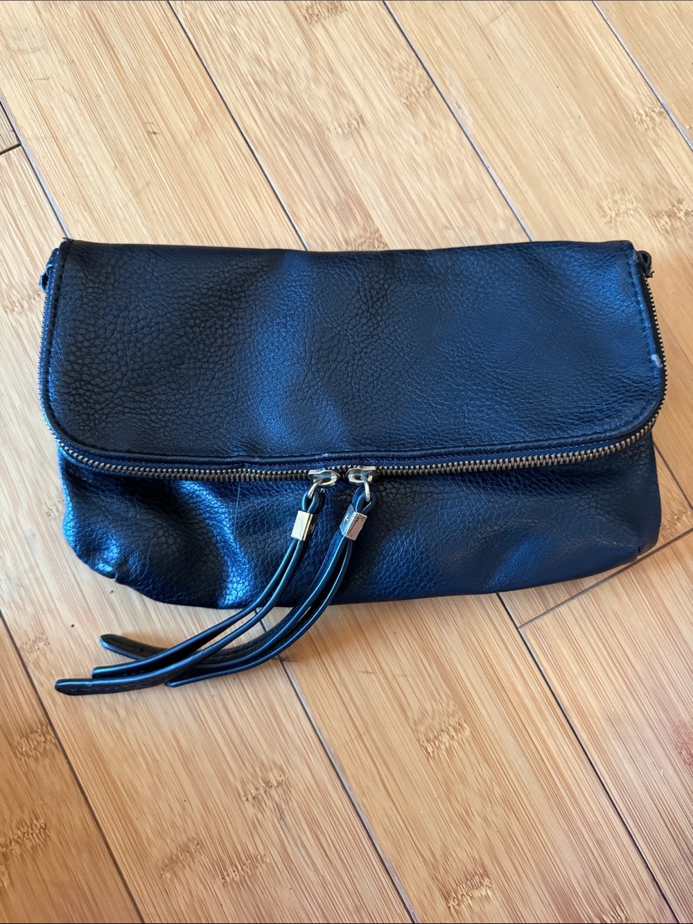 Black Pebbled Leather Fold-Over Clutch with Tassel Zips